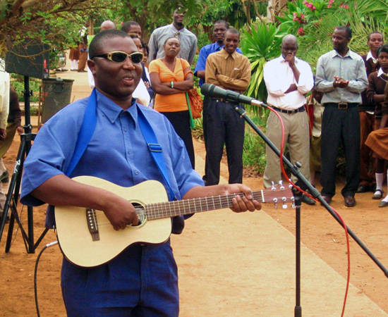 Mr. Mahachi playing John Farrell’s Guitar